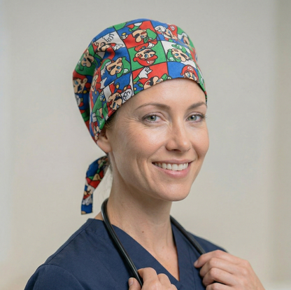 A female model wearing the colorful floral surgical cap and blue scrubs, demonstrating a professional and secure fit against a neutral studio background.