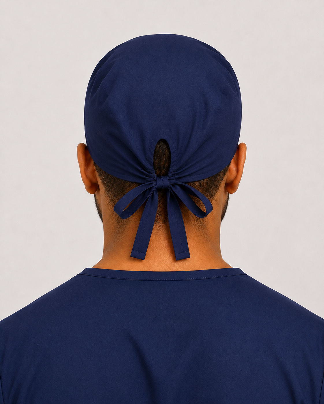 Solid navy satin-lined surgical cap, back view showing the tie