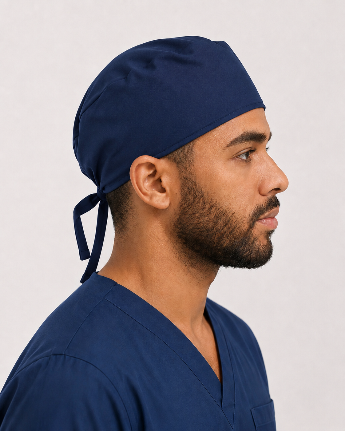 Solid navy satin-lined surgical cap, side view