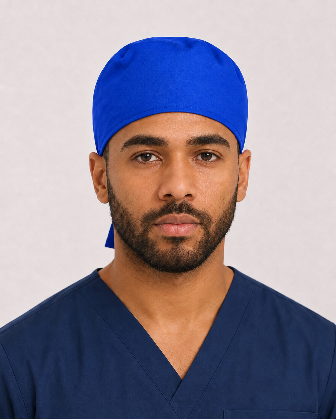 Solid royal blue satin-lined surgical cap, front view