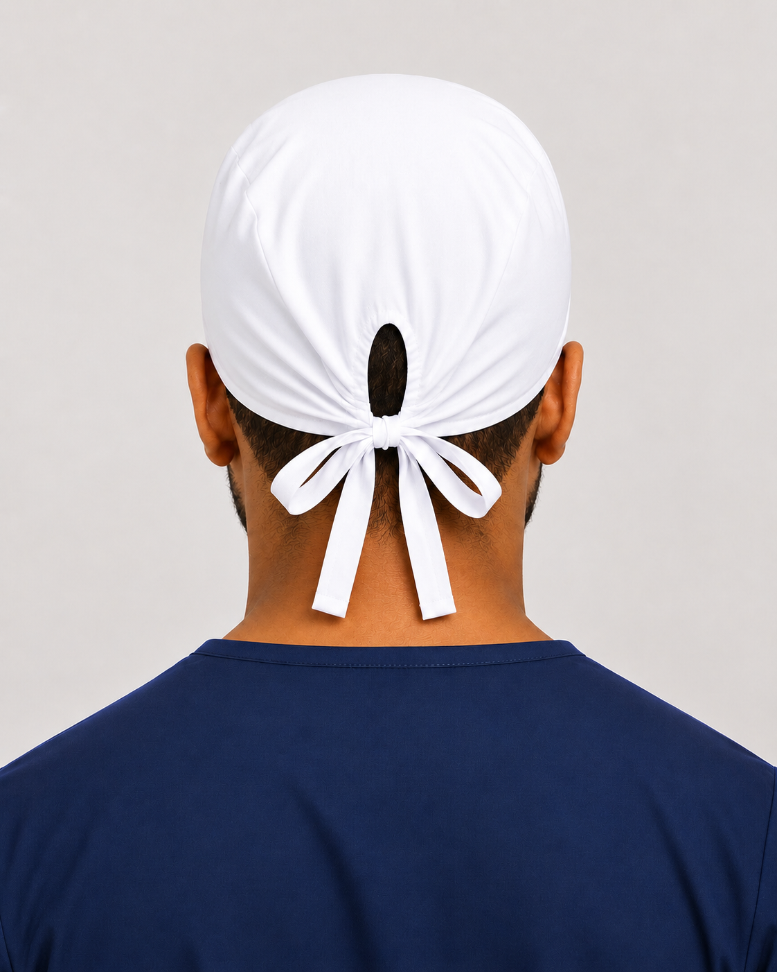 Solid white satin-lined surgical cap, back view showing the tie