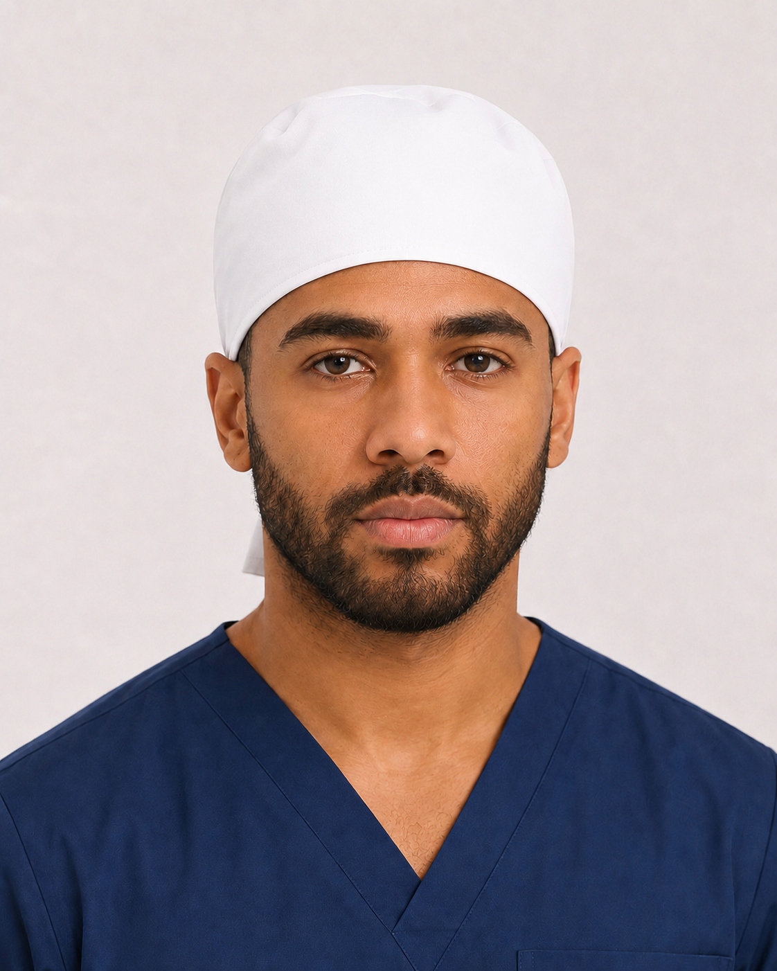 Solid white satin-lined surgical cap, front view